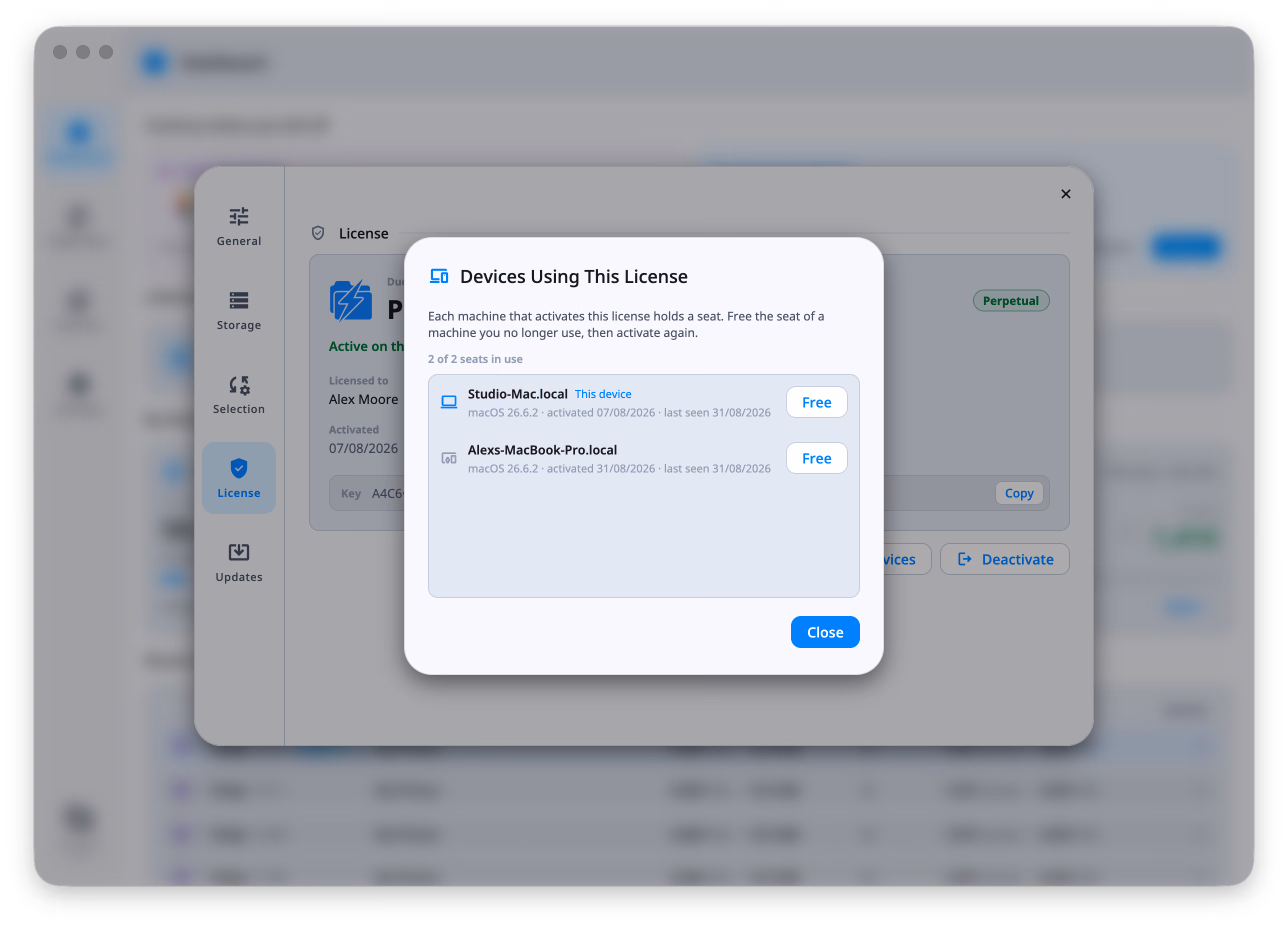 The Devices Using This License dialog over DuoBolt's Settings: a line reading 2 of 2 seats in use, then two machines — Studio-Mac.local, marked This device, and Alexs-MacBook-Pro.local — each stating the macOS version it runs, when it was activated and when it was last seen, with a Free button at the right of its row.